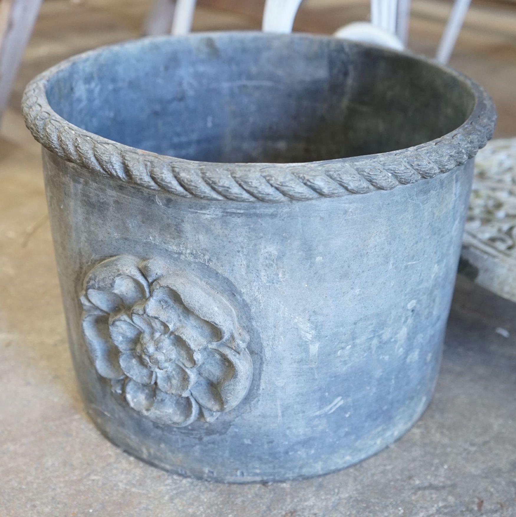 A circular lead planter, diameter 33cm, height 24cm